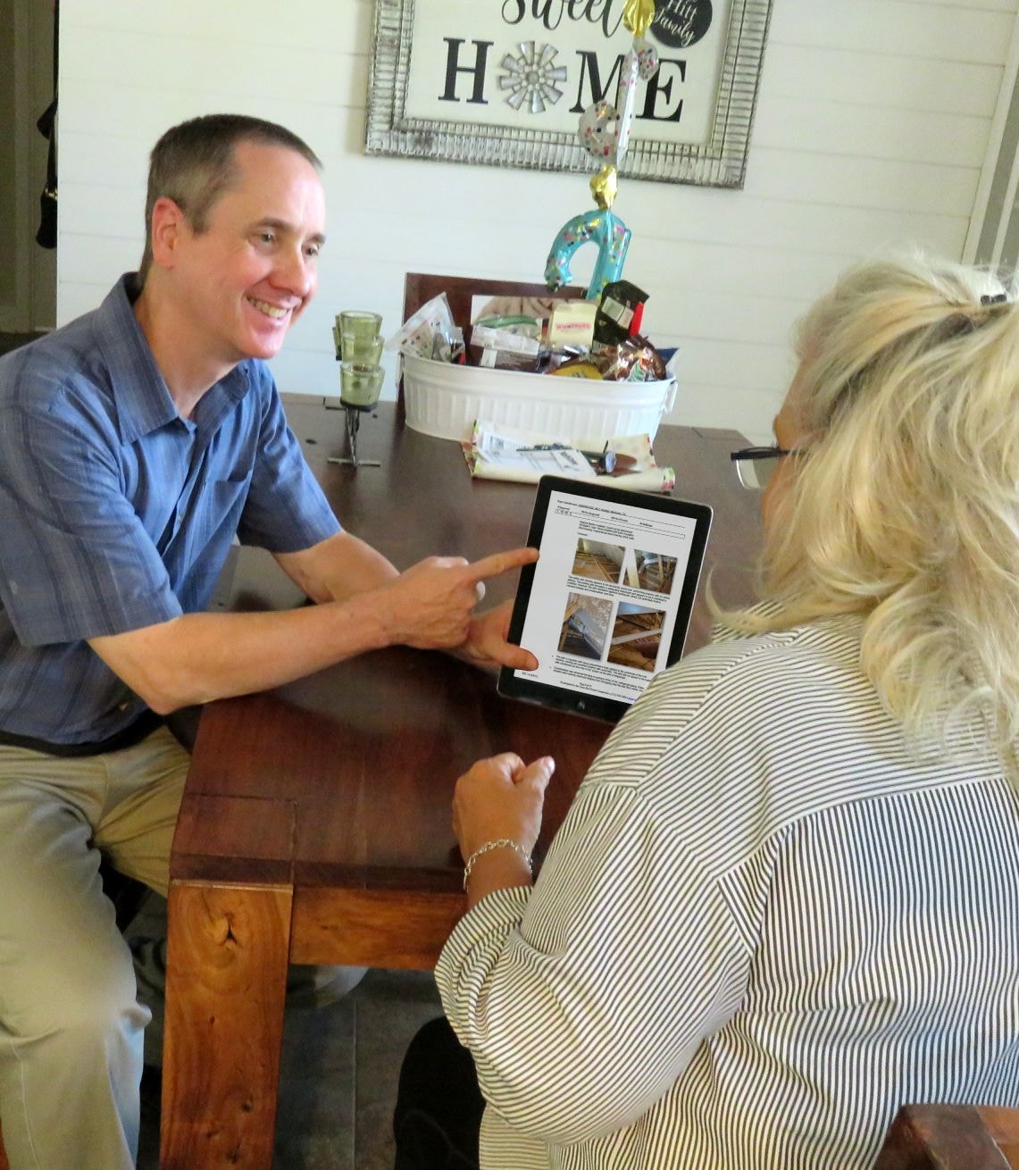 Home inspector explaining findings to a client during a walkthrough